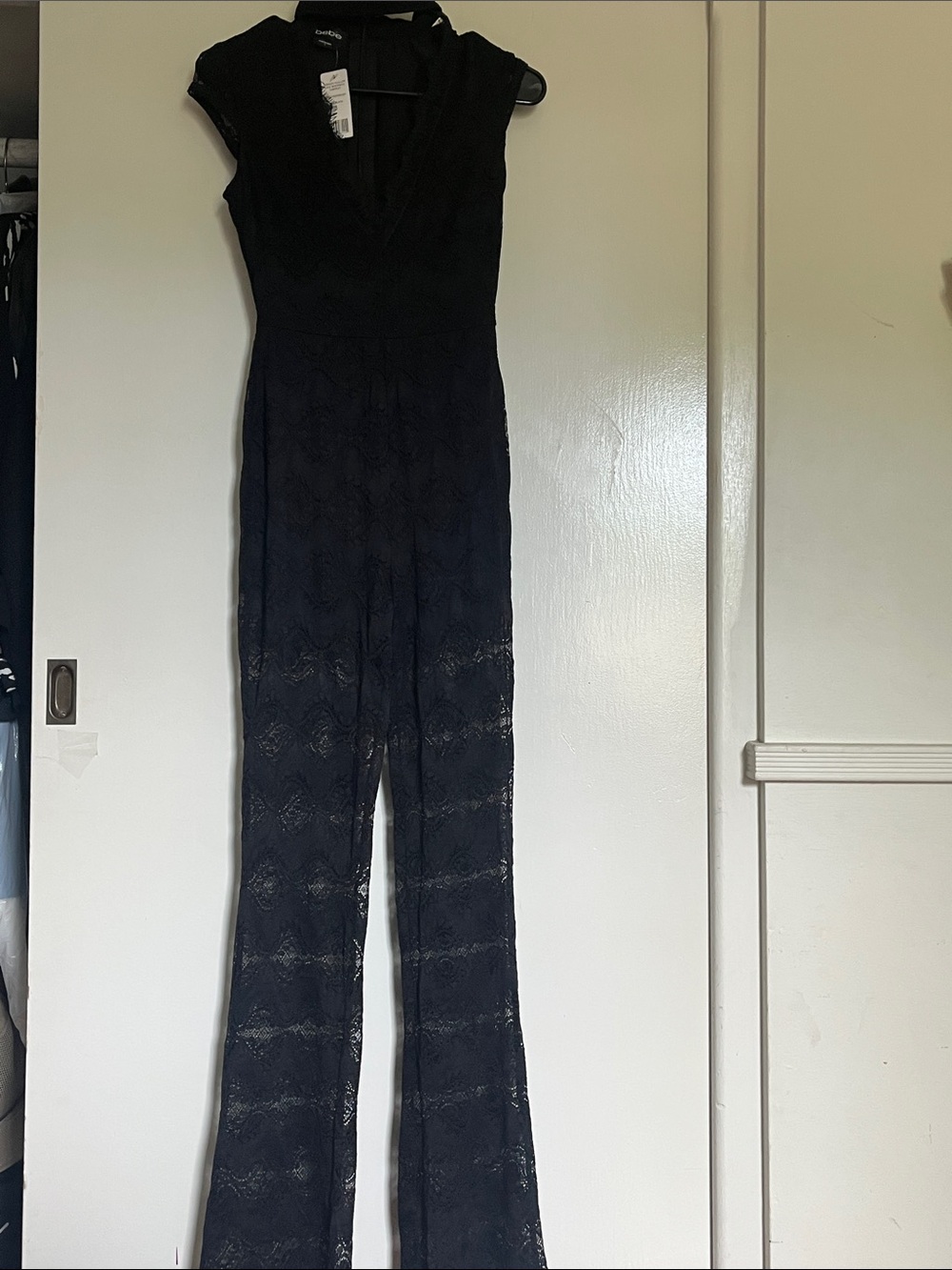 bebe Black Lace V‑Neck Jumpsuit